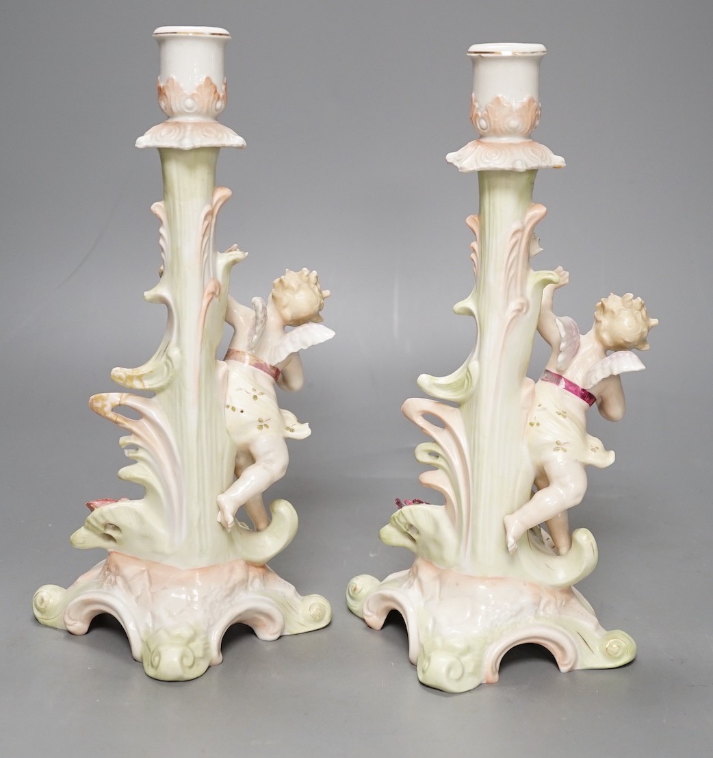 A Meissen flower painted pierced dish and two German porcelain candlesticks - 25.5cm tall